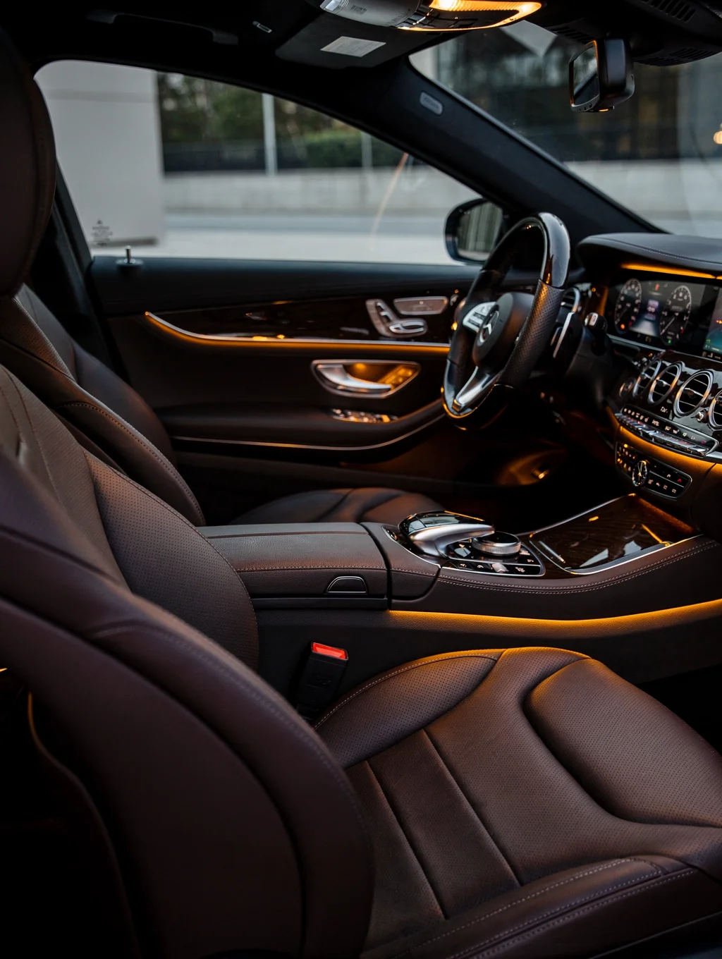 Luxury executive black car interior with leather seating and ambient lighting